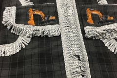Cab set in Grey Highlander tartan with silver/grey bullion trim.  Featuring embroidery specifically requested by customer.
