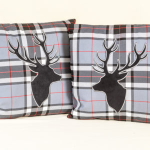 Pair of tartan cushions with stag's heads from Whiterig Truck Curtains