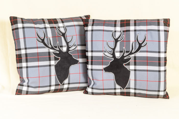 Pair of tartan cushions with stag's heads from Whiterig Truck Curtains