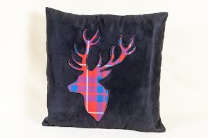 Black cushion with stag's head from Whiterig Truck Curtains