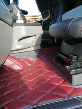Image of a maroon coloured floor mat by Whiterig fitted in a Scania Next Gen S cab